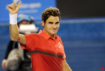 federer advances to 3rd round with walkover