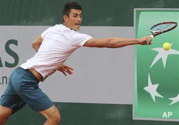 french open dad banned tomic retires from 1st match