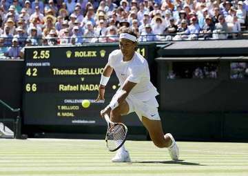 roger federer and rafael nadal move into second round at wimbledon