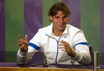 nadal says he is far from federer s grand slam record
