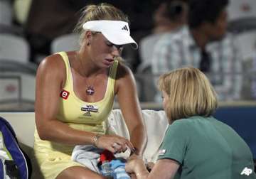tearful wozniacki injured in shock defeat