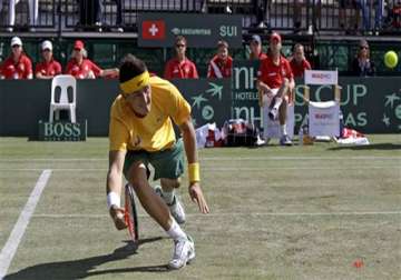 tomic beats wawrinka to give australia 1 0 lead