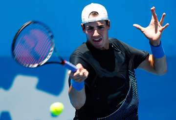 top seeded isner into 2nd round at delray beach