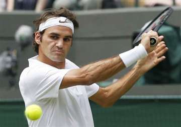 wimbledon roger federer shows no mercy in opener