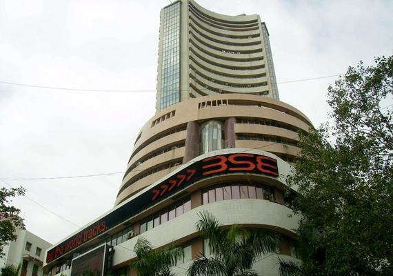sensex reverses losses to end 51 pts up hindalco tcs shine