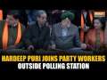 Delhi Elections 2025: Union Minister Hardeep Puri Helps Out BJP Workers Outside Polling Station