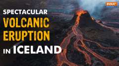 Aerials show Icelandic volcano spewing lava  into the night sky