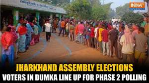 Jharkhand Assembly Elections: People queue up at a polling station in Dumka to vote in final phase