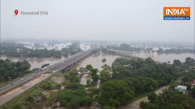 Overflowing Thamirabarani river breaches nearby areas in Tirunelveli ...