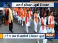 Members of Durga Vahini hold a foot march carrying weapons and saffron flags in Bijnor