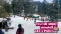 Tourists enjoy snowfall in J&K's Patnitop