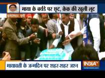 Party workers loot cake during BSP Supremo Mayawati