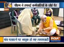 PM Modi takes holy dip at Sangam, washes feet of sanitation workers