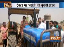 BJP MP and Mathura candidate Hema Malini drives a tractor in Govardhan