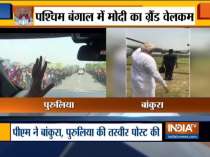 PM Modi gets a grand welcome by people in parts of Bengal