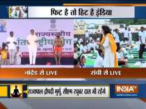 Baba Ramdev performs yoga along with Maharashtra CM Devendra Fadnavis in Nanded on International Day of Yoga