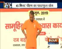 CM Yogi Adityanath performs neck exercises in Lucknow on International Yoga Day
