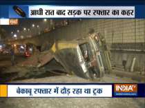4 hurt as truck falls off flyover after hitting taxi at Vile Parle in Mumbai