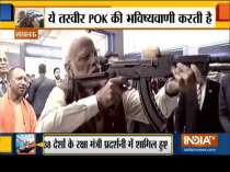 WATCH: At Defence Expo, PM Modi fires at virtual firing range with assault rifle