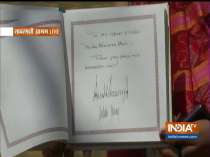 US President Donald Trump writes a message in the visitors