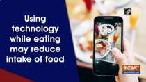 Using technology while eating may reduce intake of food