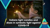 Indians light candles and diyas in symbolic fight against COVID-19