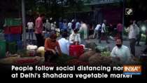 People follow social distancing norms at Delhi