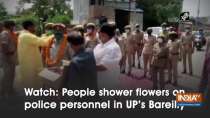 Watch: People shower flowers on police personnel in UP