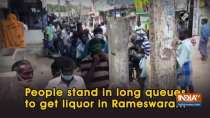 People stand in long queues to get liquor in Rameswaram