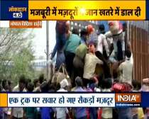 Hundreds of laborers boarded a truck to go home in Vidisha, Madhya Pradesh