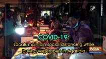 COVID-19: Locals maintain social distancing while buying vegetables in Agartala