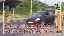Police personnel check vehicles at Delhi-UP border