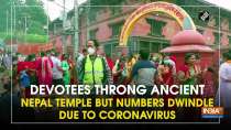 Devotees throng ancient Nepal temple but numbers dwindle due to coronavirus