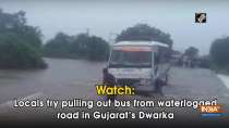 Watch: Locals try pulling out bus from waterlogged road in Gujarat