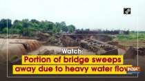 Watch: Portion of bridge sweeps away due to heavy water flow