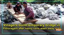 Villagers build temporary bridge in Pithoragarh after heavy rains wash away road