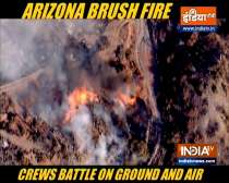 Arizona brush fire: Crews battle on ground and air