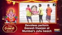 Devotees perform Ganesh Visarjan at Mumbai