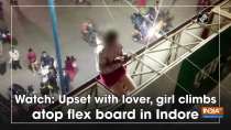 Watch: Upset with lover, girl climbs atop flex board in Indore
