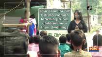 Education for all! Odisha woman teaching tribal children near their dwellings