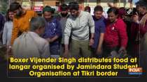 Boxer Vijender Singh distributes food at langar organised by Jamindara Student Organisation at Tikri border
