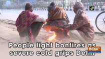 People light bonfires as severe cold grips Delhi