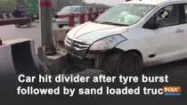 Car hit divider after tyre burst followed by sand loaded truck