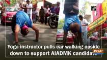 Yoga instructor pulls car walking upside down to support AIADMK candidate