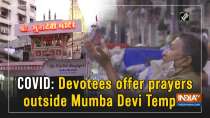 COVID: Devotees offer prayers outside Mumba Devi Temple