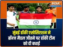 Mumbai Hockey Association players celebrate India's first Olympic hockey medal in 41 years