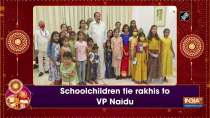 Schoolchildren tie rakhis to VP Naidu
