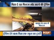 Thane: Man trains three-year-old son to load pistol, video goes viral