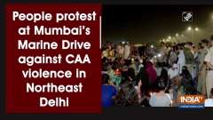 People protest at Mumbai's Marine Drive against CAA violence in Northeast Delhi