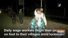 Daily wage workers begin their journey on foot to their villages amid lockdown